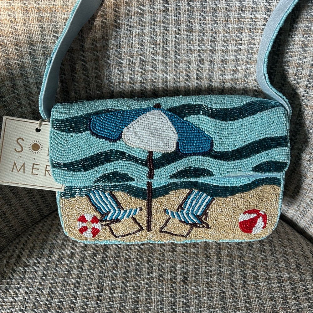 Viral beaded shoulder bag with beach scene